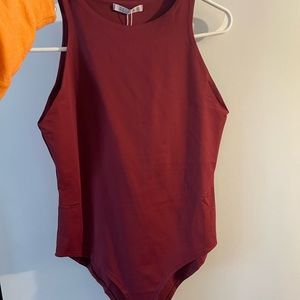 high neck/racer back type bodysuit with button closure